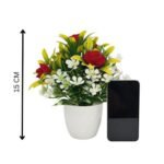 Artificial flower plant with red and white flowers and green leaves in a white decorative pot.