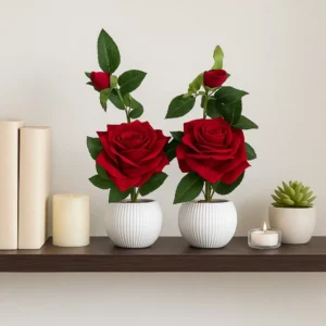Decorative artificial rose plant for home décor with red roses in white plastic pot.