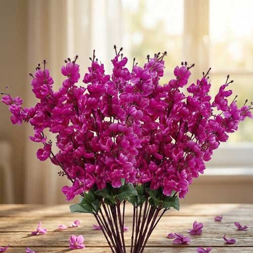 Artificial Cherry Blossom Flower Decoration – Premium Faux Floral Accent. Artificial cherry blossom flowers in red and purple displayed in a clear glass vase for interior decoration